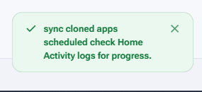 A green confirmation toast reading: sync cloned apps scheduled, check Home Activity logs for progress